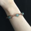 Crackle beads (blue) wrapped in copper